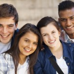 Group of teens smiling outside