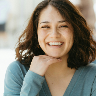 Smiling Woman Outdoors with Happy Expression